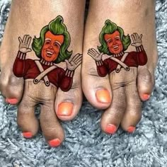 two feet with tattoos on them and one has a green haired woman's face