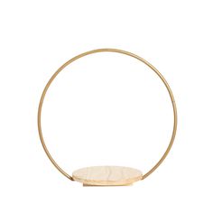 a circular wooden object on a white background