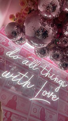 the words sparkle with love are projected in front of some disco balls and pink roses