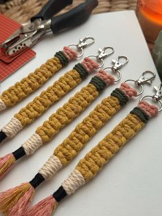 four tasseled key chains with scissors on top