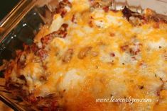 a casserole dish with meat and cheese on it in a glass baking dish