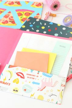 various stationery items are laid out on a table