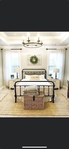 a bed room with a neatly made bed and a basket on the floor next to it