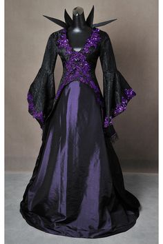 a purple and black dress with long sleeves