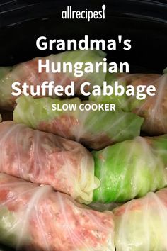 some food wrapped in plastic sitting inside of a slow cooker with the words grandma's hungarian stuffed cabbage on it