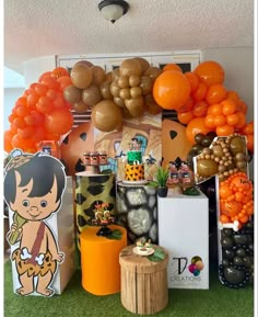 there are many balloons and decorations on the wall in this party decorationating area, including an orange balloon