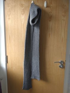 This is a hand knitted grey scarf. It is knitted in a rib pattern, perfect for a winter accessory. It is approximately 100 inches long and 5.25 inches wide. Machine washable at 30 degrees. Casual Hand Knitted Winter Scarf, White Hand Knitted Scarf One Size, Cozy Hand-knitted Scarves, Purple Knitted Scarf, Large Gray Scarf, Grey Scarf, Winter Accessories, Winter Scarf, Scarf Wrap