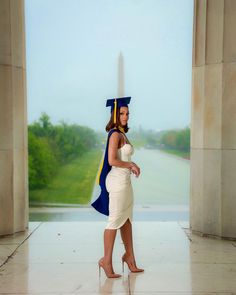 a woman in a graduation cap and gown is posing for a photo with the washington monument in the background