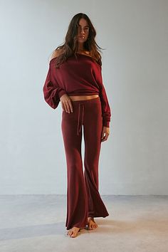 So soft Out From Under knit lounge pant in a cozy relaxed flare silhouette. Designed in a soft & stretchy jersey knit featuring a low-rise, elasticated drawstring waistline and kick-flare hem for an effortless vibe. Only at Urban Outfitters. Features Out From Under Easy Does It Cozy flare lounge pant Low rise lounge pant Soft and stretchy jersey knit Cozy soft feel Low rise waistline with drawstring tie Fitted through waist, hips and thighs Slim flare fit Full length Pull-on construction UO excl Flare Lounge Pants, Easy Does It, Lounge Pants Womens, Flare Pant, Kick Flares, Cozy Knit, Cozy Knits, Lounge Pants, Flare Pants