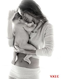 a woman holding a baby in her arms