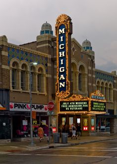 the michigan theater is lit up at night