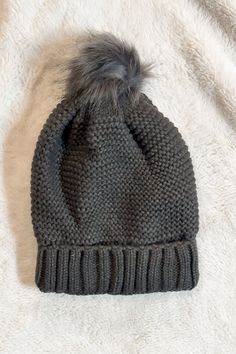 Stay snug and stylish with this quirky Pom Beanie! Featuring a chunky knit with a faux sherpa lining, this beanie is sure to keep you cozy all winter long. Go on, rock that winter vibe! Gray One Size Yarn Beanie, Cozy Gray Beanie, Hand Knitted Gray Winter Beanie, Gray One-size Beanie For Cold Weather, Gray Hand-knitted Beanie Hat, Pom Beanie, Chunky Knit, Online Boutique, Pom Pom