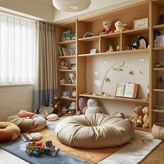 a child's room with bookshelves, toys and stuffed animals on the floor