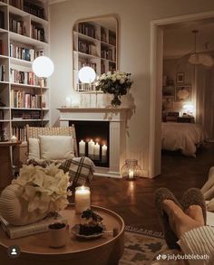 a living room filled with furniture and candles