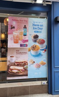 an advertisement for ice day on the side of a store front window with drinks and food