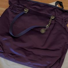 An Iconic Piece From Lanvin. Aubergine Color Satin Sack Bag. Grosgrain Trimmed, Leather Handles And Wrapping Around The Gold Hardware. Signature Medallion Is Ribbon Ties. Features An Attached Leather Bound Mirror In A Zippered Interior Pouch . Lightweight And Super Chic!! Dust Bag Brand New. Bought At Barney’s Before They Closed. Classic Purple Bags With Branded Hardware, Purple Tote Shoulder Bag With Dust Bag, Elegant Purple Bags With Gold-tone Hardware, Lanvin Happy Bag, Luxury Purple Shoulder Bag For On-the-go, Aubergine Color, Designer Purple Bag With Gold-tone Hardware, Purple Shoulder Bag With Gold-tone Hardware And Double Handle, Sack Bag