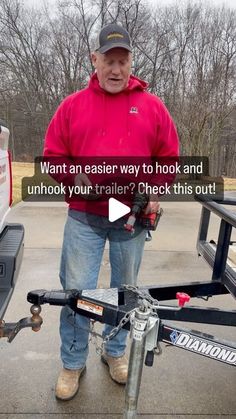 a man standing next to a trailer with the words want an easier way to hook and unhook your trailer? check this out