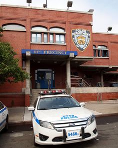 a police car parked in front of a building