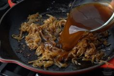 someone is pouring caramel sauce on some food in a skillet