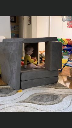 a child is playing in a play house made out of concrete