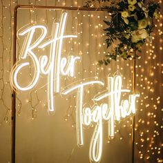 a lighted sign that says better together