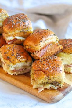 ham and cheese sliders on a cutting board