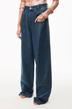 These oversized wide-leg jeans from Alexander Wang are the perfect relaxed fit. Crafted in deep indigo denim with clear lamination coating and finished with a button fly closure and exaggerated scoop pockets. Ultra cool, we'll be pairing this versatile style simply with classic shirting all-year round. Colour:Dark Indigo Care & Sizing 100% Cotton. Hand Wash Cold.This style fits true to size. Standard Denim Sizing.Model is 5'10" and wears a size 26. Coated Denim Jeans, Designer Denim Jacket, Alexander Wang Bag, Coated Denim, Deep Indigo, Denim Belt, Jean Pockets, Designer Denim, Indigo Denim