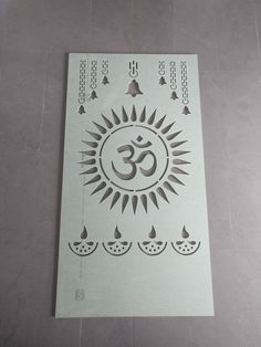 a white paper with an image of the sun and symbols on it