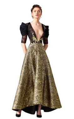 Get glam in this red carpet evening gown by Edward Arsouni Couture. The magnificent bodice has a dramatically plunging v-neckline and luscious lace elbow length sleeves with sophisticated pleated accents. This memorable ensemble sparkles with gilded adornments and shimmers to the long high-low silhouette hem in rich, paisley patterned waves.  #eveninggown #couture #fashion #womensfashion #blacktie Edward Arsouni, Couture Mode, Beauty Dress, Zuhair Murad, Designer Gowns, Gorgeous Gowns, Beautiful Gowns, Fancy Dresses, Dream Dress