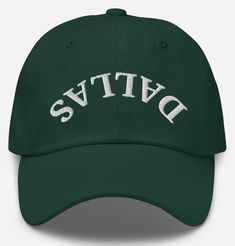 a green hat with the word dats embroidered on it