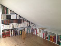 a room that has some books on the shelves