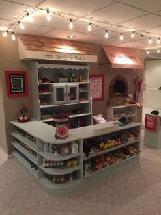 the inside of a toy store with lots of shelves and food on display in it