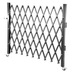 a metal gate with wheels on it and an extension rod to the side that is attached