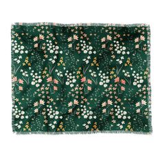 a green bandana with flowers and leaves on it