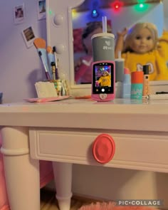 a doll is taking a selfie in front of a mirror with her cell phone