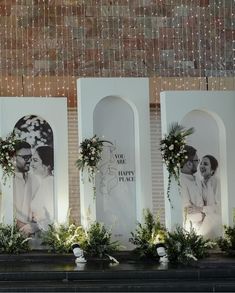 three white frames with flowers and greenery on them