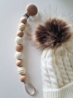 a knitted hat, keychain and wooden beads