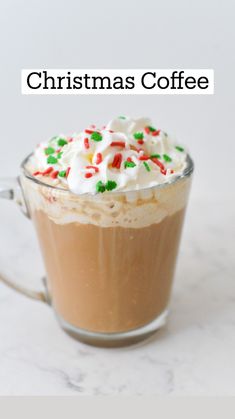 a hot chocolate drink with whipped cream and candy canes