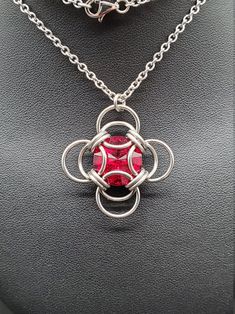 The birthstone tradition traces its roots back to ancient times, and has been found in several cultures worldwide. Garnet is recognized as the birthstone for January. While garnets can range in color from red, to yellow, to green, the most common color is a deep red, and this siam Swarovski captures its hues perfectly. Wearing the gemstone associated with your birth month is purported to bring good fortune, though it can simply make a thoughtful gift! Matching earrings available. This completed Red Gemstone Square Pendant Necklaces, Red Gemstone Square Pendant Jewelry, Red Square Pendant Gemstone Jewelry, Red Gemstone Square Pendant Necklace, Red Sterling Silver Jewelry With Round Stone, Red Gemstone Jewelry With Square Pendant, Red Gemstone Necklace With Square Pendant, Ruby Jewelry With Stone Setting As Gift, Red Birthstone Round Stone Jewelry