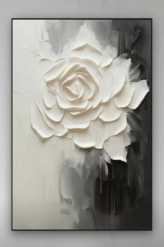 a white rose on a black and white background is featured in this modern art piece