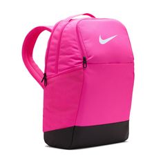 Grab your gear and get going with the Nike Brasilia Backpack. It has plenty of pockets to help you stay organized, including a sleeve to fit your laptop, side mesh pockets for water bottles, and a zippered pocket on the inside to keep small items secure. This product is made with at least 50% recycled polyester fibers. Haul loop at the top. Spacious main compartment. Padded, adjustable shoulder straps. Front zip pocket. Internal laptop sleeve. Dimensions: 18" H x 12" W x 7" D. Capacity: 24 L. Sh Pink Functional Outdoor Backpack, Functional Pink Outdoor Backpack, Pink Bags For Outdoor And Back To School, Sporty Pink Standard Backpack, Pink Nylon Backpack For Daily Use, Pink Standard Backpack For Outdoor, Pink Backpack For Outdoor, Pink Nylon Outdoor Backpack, Sporty Pink Backpack