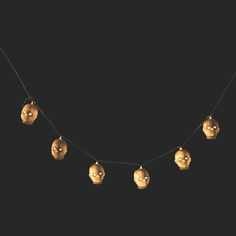 skull string lights hanging from a black background