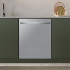 a dishwasher sitting on top of a counter next to a sink and cabinets