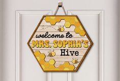 a welcome to mrs sophia's hive sign hanging on the front door