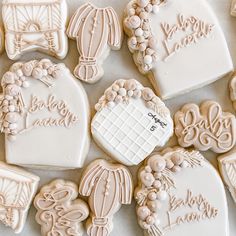 many decorated cookies are arranged on a table