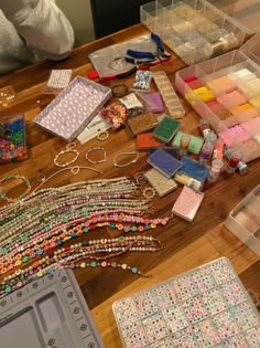 the table is covered with beads and other crafting supplies