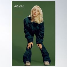 a woman with blonde hair and blue jeans posing for a magazine cover photo poster print