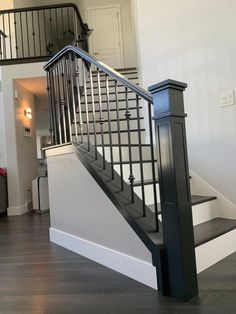 there is a black and white staircase in the house