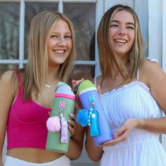 two young women are posing for the camera