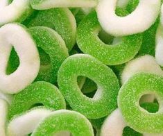 green and white donuts with sugar on them